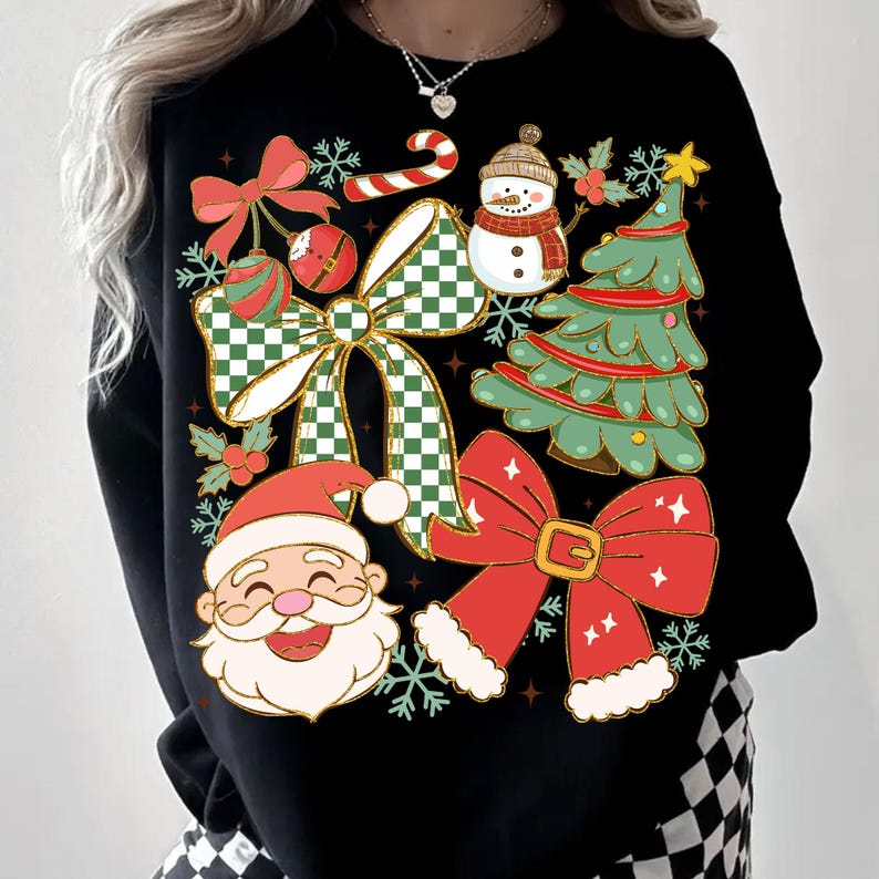 May include: Black sweatshirt featuring a festive Christmas design. The graphic includes a smiling Santa Claus, a snowman, a Christmas tree, and several red bows with green and white checkered accents. Snowflakes and candy canes complete the holiday theme.