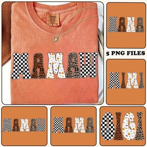 May include: An orange Comfort Colors t-shirt with the word "MAMA" in a retro font. The letters have a checkerboard, leopard print, and Halloween-themed design. A gold necklace with a pendant is also visible.