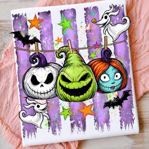 May include: A rectangular print featuring three carved pumpkins hanging from a clothesline against a purple and white striped background. The pumpkins include a white jack-o'-lantern, a green creature, and a blue-skinned character with red hair.