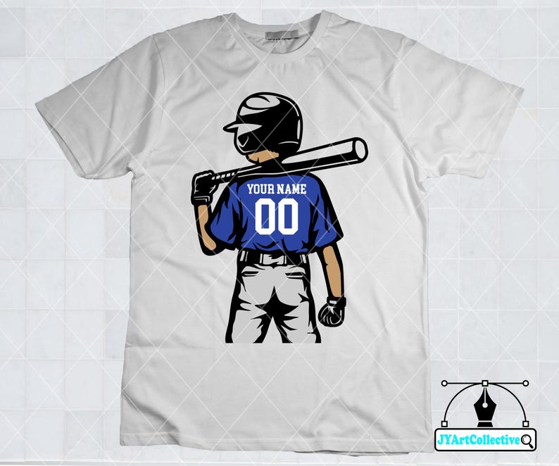 May include: White t-shirt with a blue baseball player graphic. The player is holding a bat and wearing a helmet. The text "YOUR NAME 00" is on the back of the player's jersey.