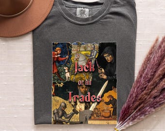 May include: A dark gray t-shirt with a collage of medieval-style illustrations. The text "Jack of all Trades" is printed in red on the shirt.