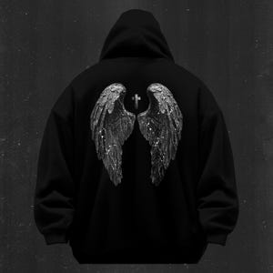 May include: Black hooded sweatshirt with a graphic of silver angel wings and a cross on the back.