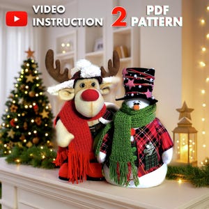 May include: Two Christmas-themed plush figures: a reindeer and a snowman. The reindeer has brown antlers, a red nose, and a red scarf. The snowman wears a plaid jacket and a green scarf. The image includes the text "VIDEO INSTRUCTION 2 PDF PATTERN".
