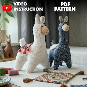 May include: Two llama soft toys, one white and one blue, are displayed. The white llama has a red and black patterned blanket with tassels. The blue llama has a floral pattern. The words "VIDEO INSTRUCTION" and "PDF PATTERN" are visible.