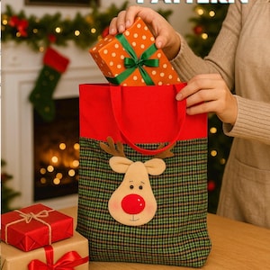 May include: A Christmas gift bag with a reindeer design, holding a polka-dot gift box with a green ribbon. Other wrapped gifts with red ribbons are on the table. The bag has a red top and handles, and a green plaid pattern.