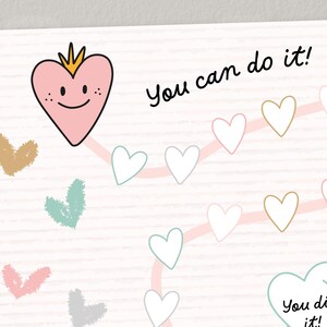 Könnte beinhalten: Ein pinkfarbenes Herz mit einer Krone und einem lächelnden Gesicht befindet sich oben auf einer Tabelle mit dem Text "You can do it!" oben. Die Tabelle hat eine rosa Linie mit weißen Herzen entlang. Die Tabelle hat den Text "You did it!" unten.