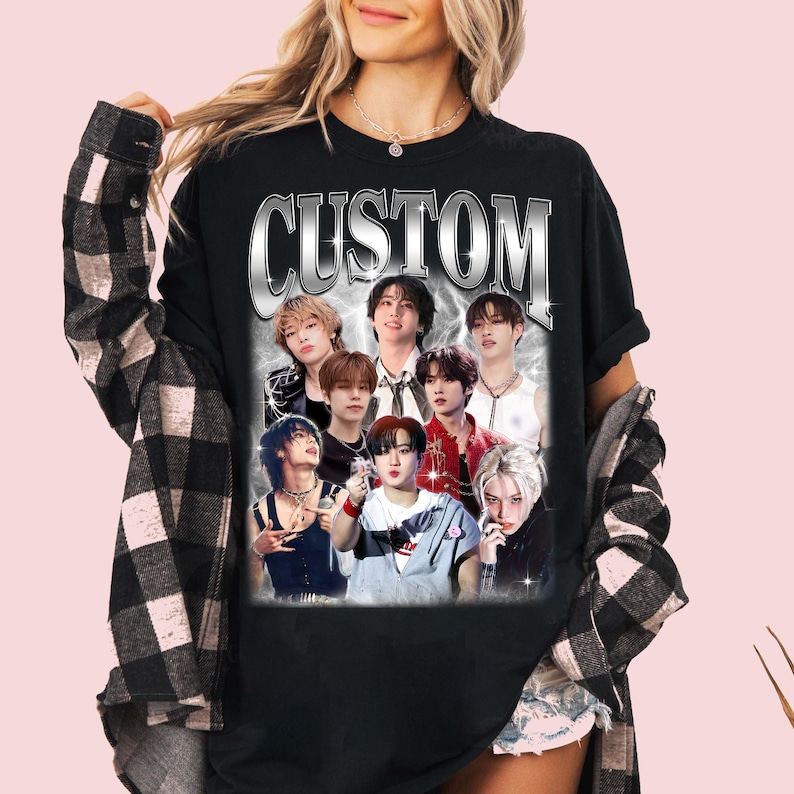 May include: Black t-shirt with a silver graphic of the word "CUSTOM" and a collage of seven men's faces.