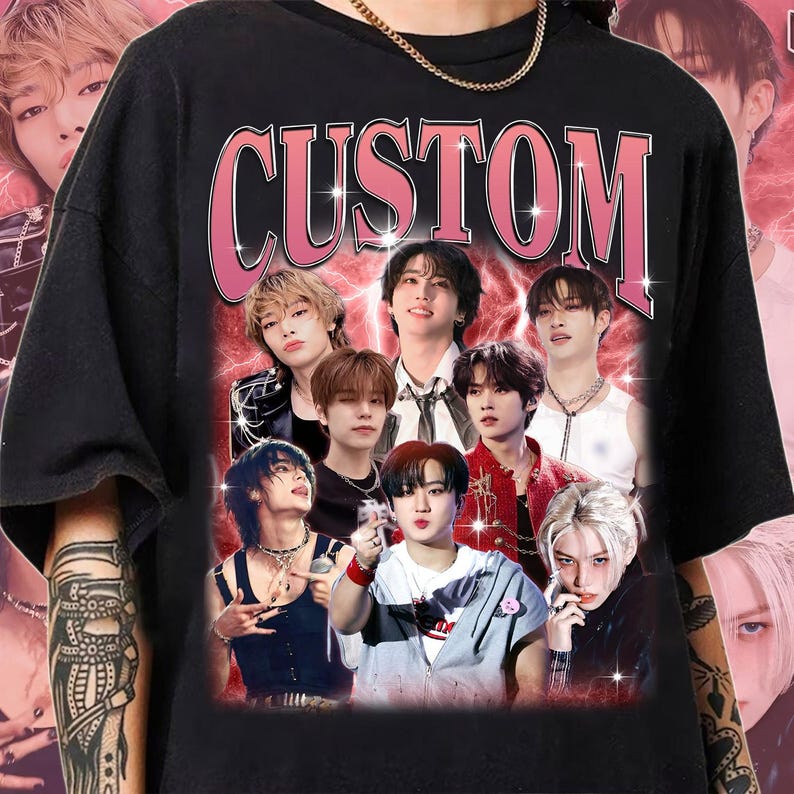 May include: Black t-shirt with a pink "CUSTOM" graphic featuring a collage of eight men's faces. The faces are surrounded by a pink lightning bolt design.