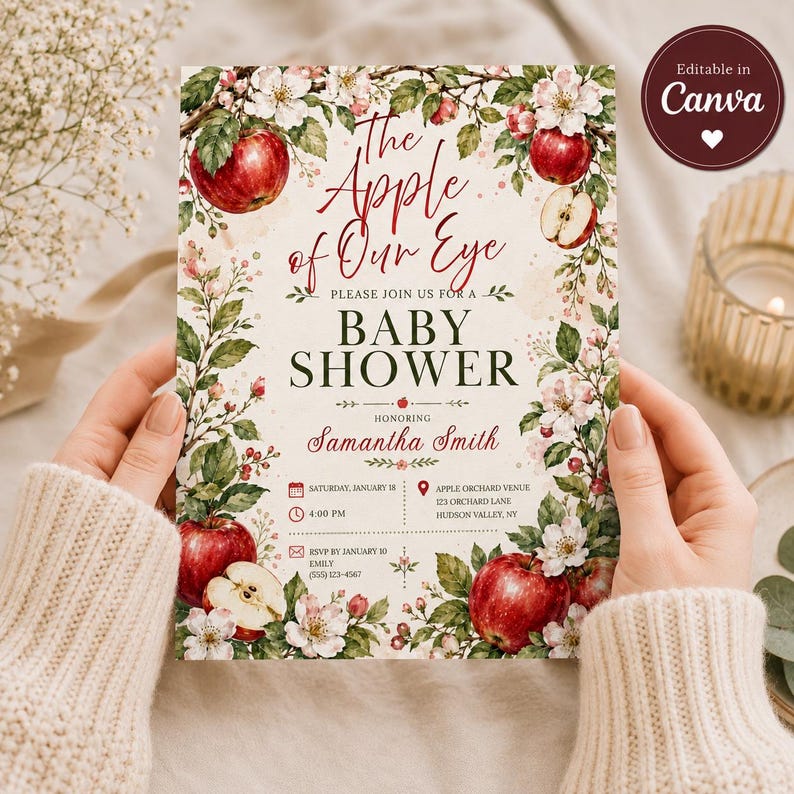 Puede incluir: Una tarjeta de invitaci&oacute;n rectangular para baby shower con una ilustraci&oacute;n en acuarela de manzanas rojas, hojas verdes y flores blancas. El texto dice The Apple of Our Eye, Baby Shower, en honor a Samantha Smith, con detalles del evento.