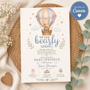 May include: A rectangular baby shower invitation card featuring a watercolor illustration of a teddy bear in a pastel hot air balloon. The text reads We can bearly wait, Baby Sprinkle, Honoring Sara Hanger, with event details and small heart icons.
