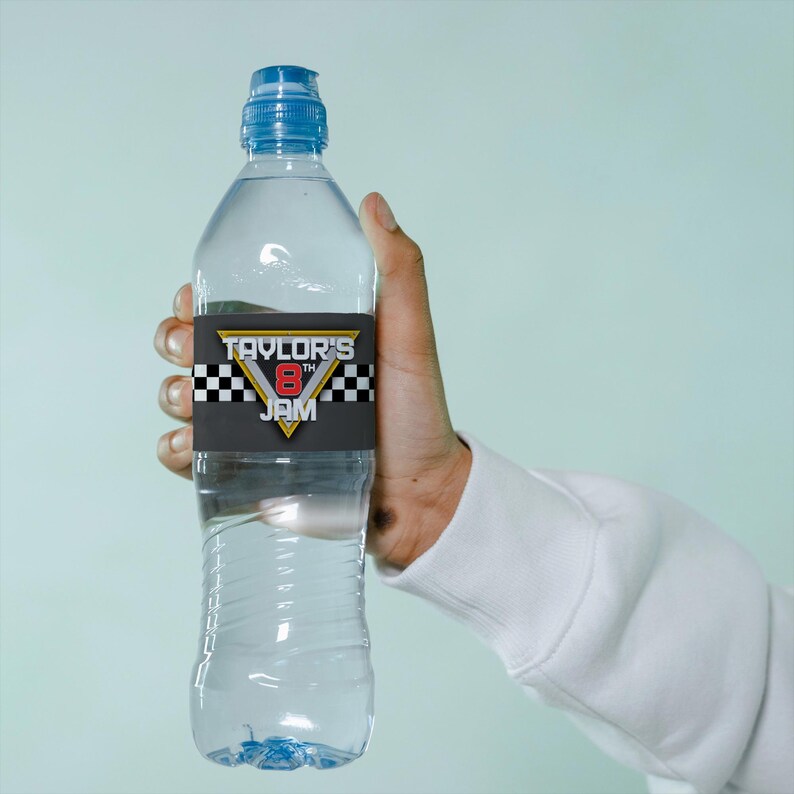 May include: A clear plastic water bottle with a blue lid and a black and white checkered label that says "Taylor's 8th Jam".