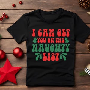 I can get you on the naughty list, Black T-shirt, Funny Christmas present, secret Santa gift, holiday fun tee, candy canes and eggnog, hot