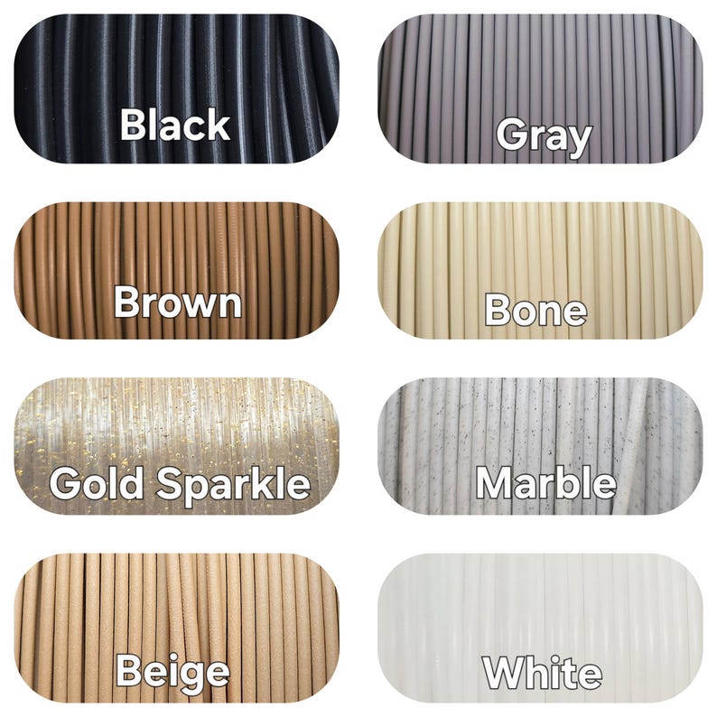 Peut inclure: Pr&eacute;sentation de bobines de filament de diff&eacute;rentes couleurs : noir, gris, marron, os, or scintillant, marbre, beige et blanc. Chaque bobine est &eacute;tiquet&eacute;e avec le nom de sa couleur en blanc.