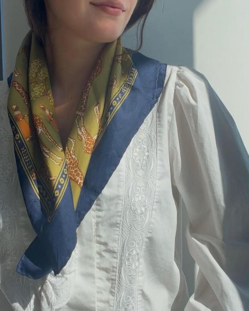 The actual scarf worn against a white shirt