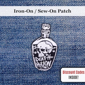 May include: An iron-on or sew-on patch showing a black and white illustration of a potion bottle with a skull inside. The words "DEATH POTION" are written on the bottle. The patch is on a blue denim background.