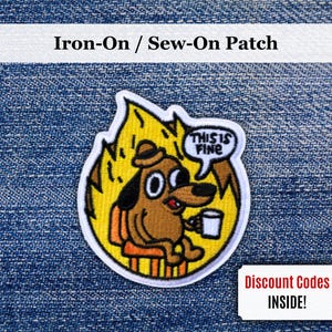 May include: Embroidered patch depicting a cartoon dog in a burning room, holding a mug and saying "This is Fine." The patch is surrounded by yellow flames and has the text "Iron-On / Sew-On Patch". A small coupon with the text "Discount Codes INSIDE!" is also visible.