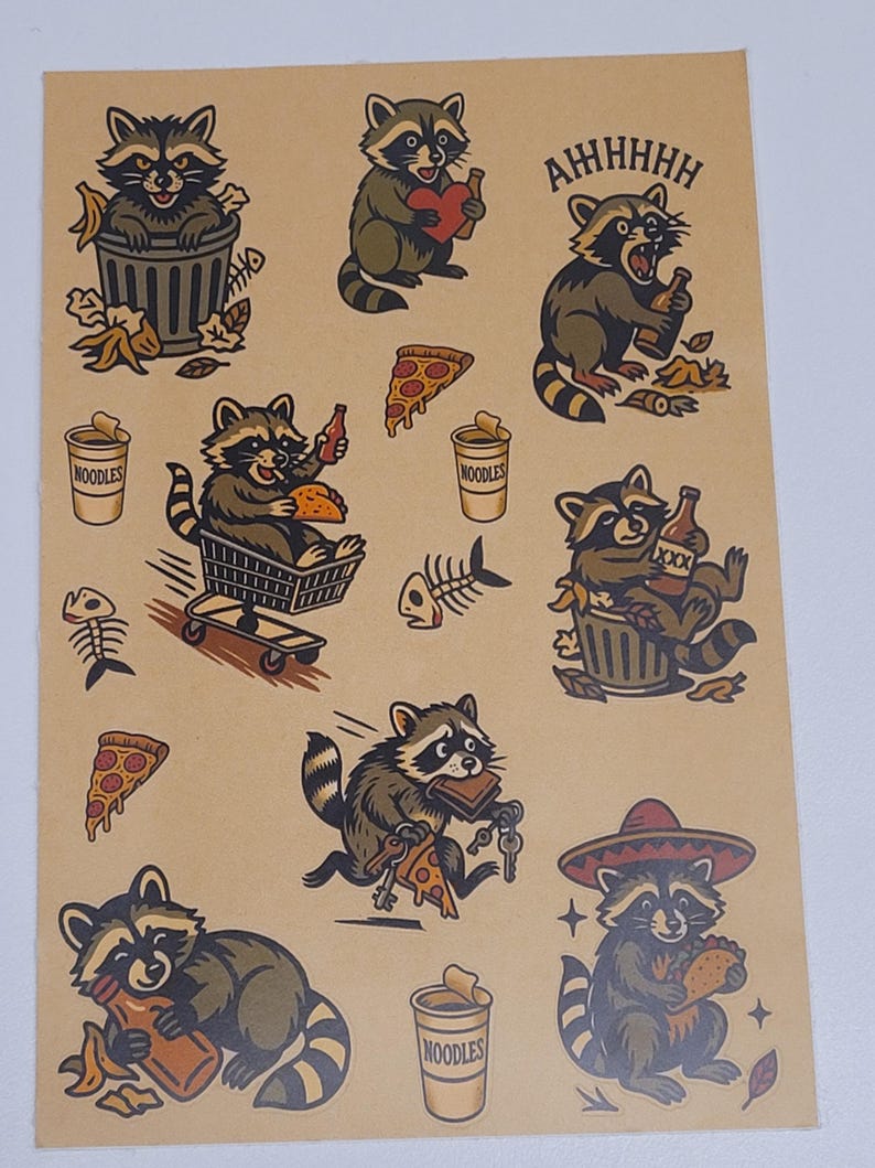 May include: A sheet of raccoon-themed stickers on a tan background. The stickers feature raccoons in various poses, including eating pizza, holding beer, and wearing a sombrero. Other images include pizza slices, noodles, and fish bones.