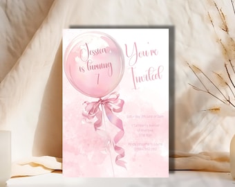 May include: Pink birthday invitation with a watercolor background and a pink balloon with the text "Jessica is turning 7" inside. The text "You're Invited" is written in a cursive font. The invitation includes the date, time, address, and contact information.