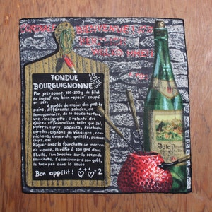 May include: A black and white tapestry depicting a fondue set with a red pot, a bottle of wine, and a wooden cutting board with the text "Fondue Bourguignonne" and instructions for preparing the dish. The tapestry also features a red apple and a brick wall background.