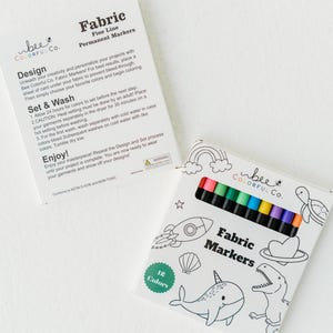 Bee Colorful Co. fabric marker box back: 12 rainbow colors, care instructions. Learn how to set designs, wash tips, and fabric use for permanent markers on kids' coloring pajamas, t-shirts, textiles. Non-toxic fabric pens, fine line tips for detailed fabric art. DIY projects, personalized gifts, fabric customization. ASTM D-4236 certified. Prevent fading, bleeding; ensure lasting color. Understand care for optimal results with these fabric markers.