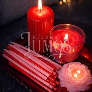 May include: A collection of lit candles in various shapes and sizes, including a large red pillar candle, a glass-encased candle, and a flower-shaped candle. Several red and pink taper candles are arranged on a red tray. The image includes the text "ETERNAL UMO".
