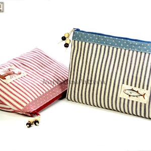 May include: Two striped fabric zippered pouches with different designs. The pouch on the left is red and white striped with a lobster design. The pouch on the right is blue and white striped with a fish design.