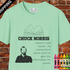 May include: A light green t-shirt with a black and white illustration of a book and the text "CHUCK NORRIS doesn't read books. He stares them down until he gets the information he wants."