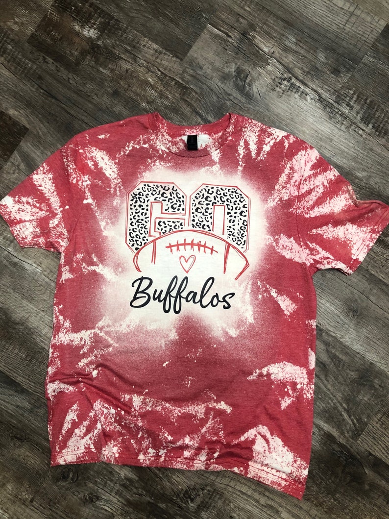 Custom bleached football mom shirt.  Add a personalized touch by adding players number along with team name.
