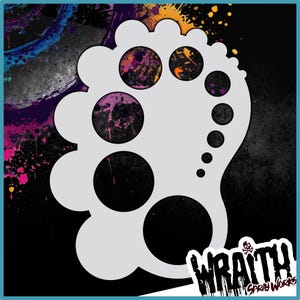 May include: A white paint stencil shaped like a paint palette with multiple circular cutouts of different sizes. The stencil is on a black background with colorful paint splatters.