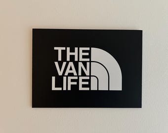 May include: Black and white print with the text "THE VAN LIFE" and a white silhouette of a mountain range.