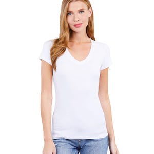 May include: White short-sleeved v-neck t-shirt with a fitted silhouette.