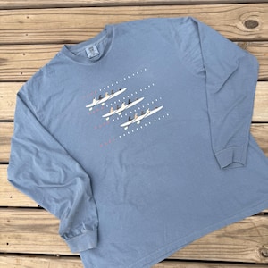Camiseta de manga larga con ilustraciones de carreras de perros