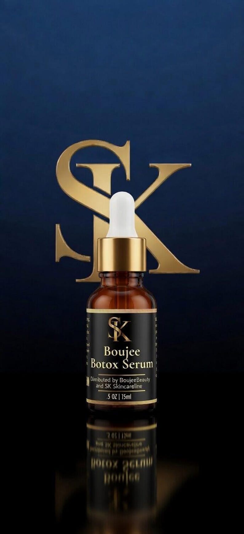 May include: A brown glass bottle of Boujee Botox Serum with a gold cap and white dropper. The label is black with gold text and the SK logo. The background is a dark blue with a gold SK logo.