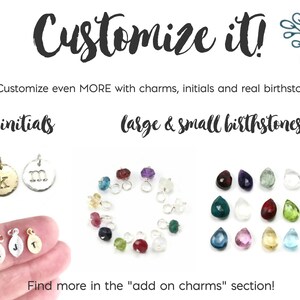May include: A close-up of a variety of charms for jewelry making. The charms include small initial letters, birthstones, and small charms. The text "Customize it!" is at the top of the image. The text "Customize even MORE with charms, initials and real birthstones!" is below the first text. The text "initials" is above a row of two charms with the letters "K" and "M". The text "large & small birthstones" is above a row of birthstones. The text "Find more in the "add on charms" section!" is at the bottom of the image.