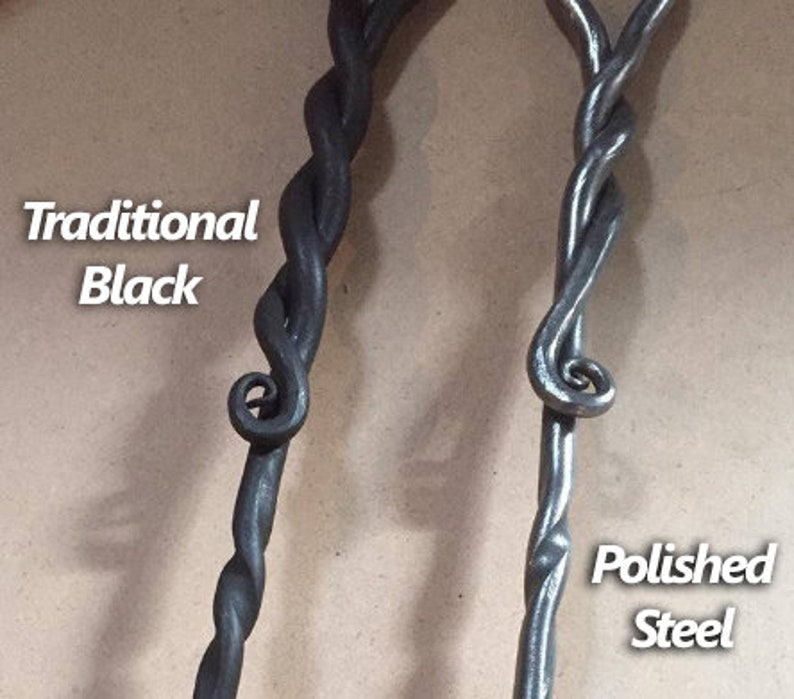 May include: Two metal fireplace tools with twisted handles. One handle is black and the other is polished steel. The text "Traditional Black" is on the left and "Polished Steel" is on the right.