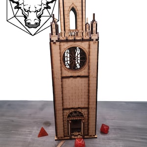 May include: A wooden model of a tall, narrow tower with a pointed roof, arched windows, and a large clock face. The tower is made of light brown wood and has a textured brick pattern. The tower is sitting on a wooden surface.