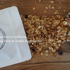 May include: A white resealable bag with the text "Pendleton Molasses We stay true to tradition, offering clean & simple ingredients."  The bag is open and spilling out granola with dried fruit and nuts.