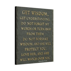 May include: A rectangular wall art piece with a dark grey background and gold lettering. The text reads "Get Wisdom, Get Understanding..." and includes a Bible verse reference. The artwork has a textured appearance.
