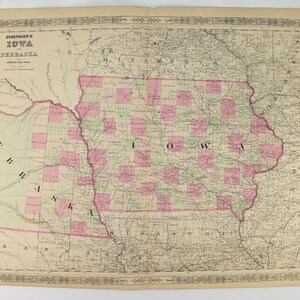 May include: An antique map of Iowa and Nebraska, showing county boundaries and major rivers. The map is printed on paper and has a faded, vintage look. The title "Johnson's Iowa and Nebraska" is printed at the top of the map.