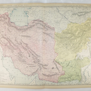 May include: A vintage map of Persia, Afghanistan, and Baluchistan. The map is printed in black and white with colored borders. The map shows the countries' borders, major cities, and geographic features.