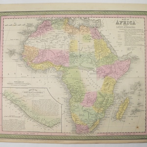 May include: An antique map of Africa from 1851, published by Thomas Cowperthwaite. The map is printed in black and white with colored borders and regions. It includes the text "Map of Africa from the Latest Authorities" and "Published by Thomas Cowperthwaite".