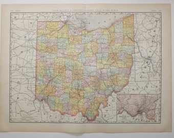 May include: A vintage map of Ohio, showing the state's counties and major cities. The map is printed in black and white with colored borders for each county. The map is titled "Rand McNally & Company's Indexed Atlas of the World".