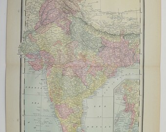 May include: A vintage map of India, showing the different states and regions of the country. The map is printed in a variety of colors, including green, yellow, pink, and blue. The map is titled "India" and includes a scale bar and a legend.