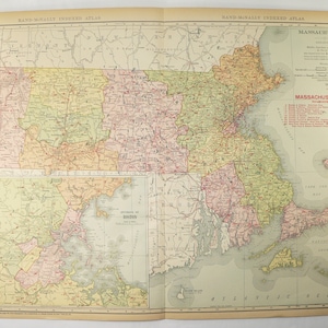 May include: A vintage map of Massachusetts, showing the state's counties and major cities. The map is printed in shades of green, yellow, and pink, with red lines indicating roads. The map is titled "Rand McNally Indexed Atlas" and includes a key to the map's symbols.