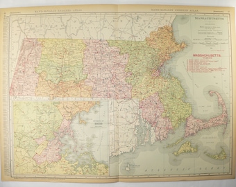 May include: A vintage map of Massachusetts, showing the state's counties and major cities. The map is printed in shades of green, yellow, and pink, with red lines indicating roads. The map is titled "Rand McNally Indexed Atlas" and includes a key to the map's symbols.
