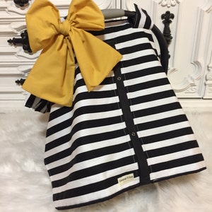 black and white car seat canopy with bow