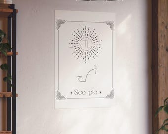May include: A white poster featuring a black Scorpio zodiac design. The design includes a sunburst, the Scorpio symbol, and the constellation. The word "Scorpio" is written at the bottom.