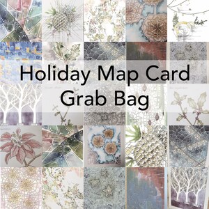 May include: A collection of watercolor art cards with various designs, including botanical illustrations, abstract patterns, and map-like compositions. The text "Holiday Map Card Grab Bag" is displayed in the center. The cards feature a mix of colors and styles.