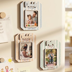 May include: Three magnetic photo frames with the words "Daddy" and "Papa" in a decorative font. Each frame has a photo of a father and child. The frames have a striped background in pastel colours. The text "I love you" is also present.