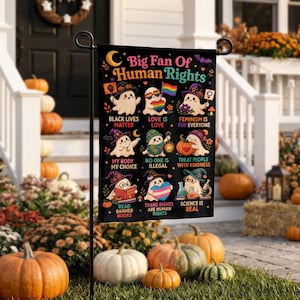 May include: A black garden flag with the text "Big Fan Of Human Rights" and illustrations of ghosts holding symbols of social justice. The flag includes phrases like "Black Lives Matter" and "Love is Love."